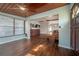 Spacious living room boasting hardwood floors, a wood ceiling, and an inviting open layout at 7108 N Howard Ave, Tampa, FL 33604