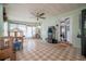 Spacious sunroom with arcade game and lots of space for games and activities at 7108 N Howard Ave, Tampa, FL 33604