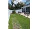 Outdoor space with a paver patio, outdoor furniture, and a grassy area enclosed by a white vinyl fence at 7120 Early Gold Ln, Riverview, FL 33578
