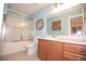 Bathroom featuring a shower and wood cabinet vanity at 7120 Early Gold Ln, Riverview, FL 33578