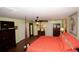 Bright bedroom features a four-poster bed, dark wood furniture, and ample closet space at 7120 Early Gold Ln, Riverview, FL 33578
