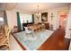Bright dining area with a wooden table, area rug, and lovely decor at 7120 Early Gold Ln, Riverview, FL 33578
