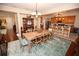 Elegant dining room featuring wood table, chairs, and decorative lighting at 7120 Early Gold Ln, Riverview, FL 33578