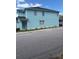 Two-story home showing a light blue exterior and dark roof, and trimmed window views at 7120 Early Gold Ln, Riverview, FL 33578