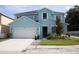 Charming two-story home with a well-manicured lawn, an attached two-car garage, and a welcoming front entrance at 7120 Early Gold Ln, Riverview, FL 33578