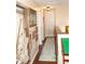 Upper hallway with artwork on display, leading to various rooms with fresh neutral paint at 7120 Early Gold Ln, Riverview, FL 33578