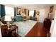 Spacious living room with hardwood floors, large windows, and inviting furniture at 7120 Early Gold Ln, Riverview, FL 33578