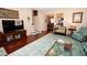 Cozy living room showcases hardwood floors, comfortable furniture, and natural light at 7120 Early Gold Ln, Riverview, FL 33578