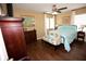 Cozy bedroom with hardwood floors, fan and comfortable furniture at 7120 Early Gold Ln, Riverview, FL 33578