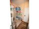 Well-organized pantry with ample shelving, stocked with household essentials, and a tiled floor at 7120 Early Gold Ln, Riverview, FL 33578