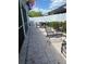 Paver patio with outdoor furniture, and enclosed porch with white vinyl privacy fence at 7120 Early Gold Ln, Riverview, FL 33578