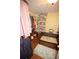 Walk-in closet with wood floors, custom shelving for storing shoes, and a bench at 7120 Early Gold Ln, Riverview, FL 33578