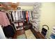 Walk-in closet with plenty of shelving and hanging storage at 7120 Early Gold Ln, Riverview, FL 33578