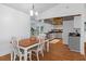 Inviting dining room with wood table and views of the modern, updated kitchen at 7337 Glasgow Rd, Weeki Wachee, FL 34613
