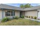 Charming home featuring painted brick accents and a walkway leading to the front door at 7337 Glasgow Rd, Weeki Wachee, FL 34613