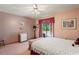Bedroom featuring floral wallpaper, sliding glass doors to the pool, and a ceiling fan at 7353 Dogwood Cres, Spring Hill, FL 34607