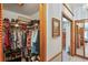 Walk-in closet with shelving and a view of the main bedroom at 7353 Dogwood Cres, Spring Hill, FL 34607