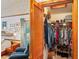 Walk-in closet with shelving and hanging racks connected to main bedroom at 7353 Dogwood Cres, Spring Hill, FL 34607
