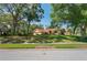 Charming home featuring a well-kept lawn and mature trees at 7353 Dogwood Cres, Spring Hill, FL 34607