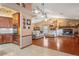 The living room features hardwood floors, a stone fireplace, and plenty of natural light at 7353 Dogwood Cres, Spring Hill, FL 34607