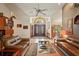 Elegant living room with plush brown leather sofas and a decorative glass-top coffee table at 7353 Dogwood Cres, Spring Hill, FL 34607