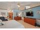 Large main bedroom with a sitting area, ensuite bathroom, and closet at 7353 Dogwood Cres, Spring Hill, FL 34607