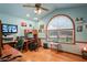 Spacious home office with vaulted ceilings and a large arched window at 7353 Dogwood Cres, Spring Hill, FL 34607