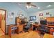 Well-appointed home office with wood flooring and a ceiling fan at 7353 Dogwood Cres, Spring Hill, FL 34607