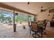 Covered patio with brick flooring, ceiling fans, outdoor furniture, and a view of the pool at 7353 Dogwood Cres, Spring Hill, FL 34607