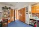 Versatile room featuring multiple closets with louvered doors, shelves, and blue carpeting at 7353 Dogwood Cres, Spring Hill, FL 34607