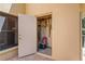 Outdoor storage room with an open door, offering space for tools and equipment, ensuring organized yard maintenance at 7353 Dogwood Cres, Spring Hill, FL 34607