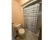 Bathroom featuring a toilet and a shower with a striped curtain for added privacy at 7360 Ulmerton Rd # 20F, Largo, FL 33771