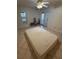 Bright bedroom featuring tile floors, a ceiling fan, and a door to the outside at 7360 Ulmerton Rd # 20F, Largo, FL 33771