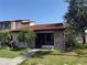 Charming home with red tile roof, brick accents, and lush landscaping in a desirable neighborhood at 7360 Ulmerton Rd # 20F, Largo, FL 33771