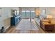 Open living room with wood floors and water views at 7500 Sunshine Skyway S Ln # 201, St Petersburg, FL 33711