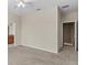 Bright, airy bedroom featuring neutral carpet and walls, plus multiple doors and a ceiling fan at 800 Callista Cay Loop, Tarpon Springs, FL 34689