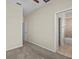 Neutral bedroom featuring plush carpet, a bathroom and a white door at 800 Callista Cay Loop, Tarpon Springs, FL 34689