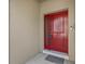 Close-up of the stunning red front door at 800 Callista Cay Loop, Tarpon Springs, FL 34689