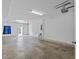 Spacious garage with white walls, overhead lighting, and ample storage space at 800 Callista Cay Loop, Tarpon Springs, FL 34689