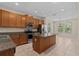Spacious kitchen with stainless steel appliances, granite countertops and adjoining dining area at 800 Callista Cay Loop, Tarpon Springs, FL 34689