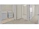 Laundry area featuring tile flooring, utility sink, washer, dryer, and shelving at 800 Callista Cay Loop, Tarpon Springs, FL 34689