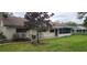 Cozy single-story home featuring a screened porch and a well-maintained lawn at 8313 Cavalry Dr, Hudson, FL 34667