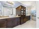 Bathroom features dual sinks, granite countertops, and a glass enclosed shower at 8434 Dunham Station Dr, Tampa, FL 33647