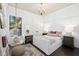 Charming bedroom with chandelier, swing chair, desk and comfortable bed at 8434 Dunham Station Dr, Tampa, FL 33647