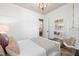 Cozy bedroom with chandelier, stylish furnishings and a unique swing chair at 8434 Dunham Station Dr, Tampa, FL 33647