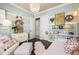 Charming bedroom with light blue walls, white trim, and decorative shelving and accents at 8434 Dunham Station Dr, Tampa, FL 33647