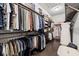 Walk-in closet with custom shelving and ample storage space at 8434 Dunham Station Dr, Tampa, FL 33647