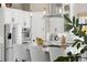 Bright kitchen features stainless steel appliances, center island, and pendant lighting at 8434 Dunham Station Dr, Tampa, FL 33647