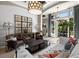 Open living space with vaulted ceilings, shiplap accent wall, and access to covered outdoor seating area at 8434 Dunham Station Dr, Tampa, FL 33647