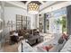 Comfortable living room showcasing a decorative wall, large windows, and stylish furnishings at 8434 Dunham Station Dr, Tampa, FL 33647
